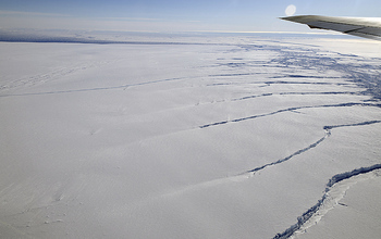 Aerial view of antarctic ice with crevases from a plane